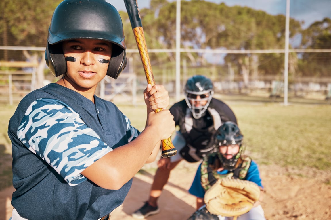 Children playing baseball on a Jays Care Foundation field with coaches and volunteers.