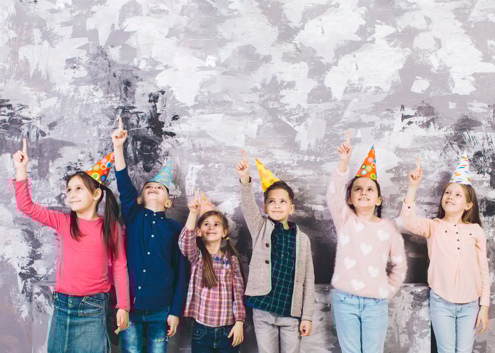 Cosy winter birthday party with blankets and themed cake.