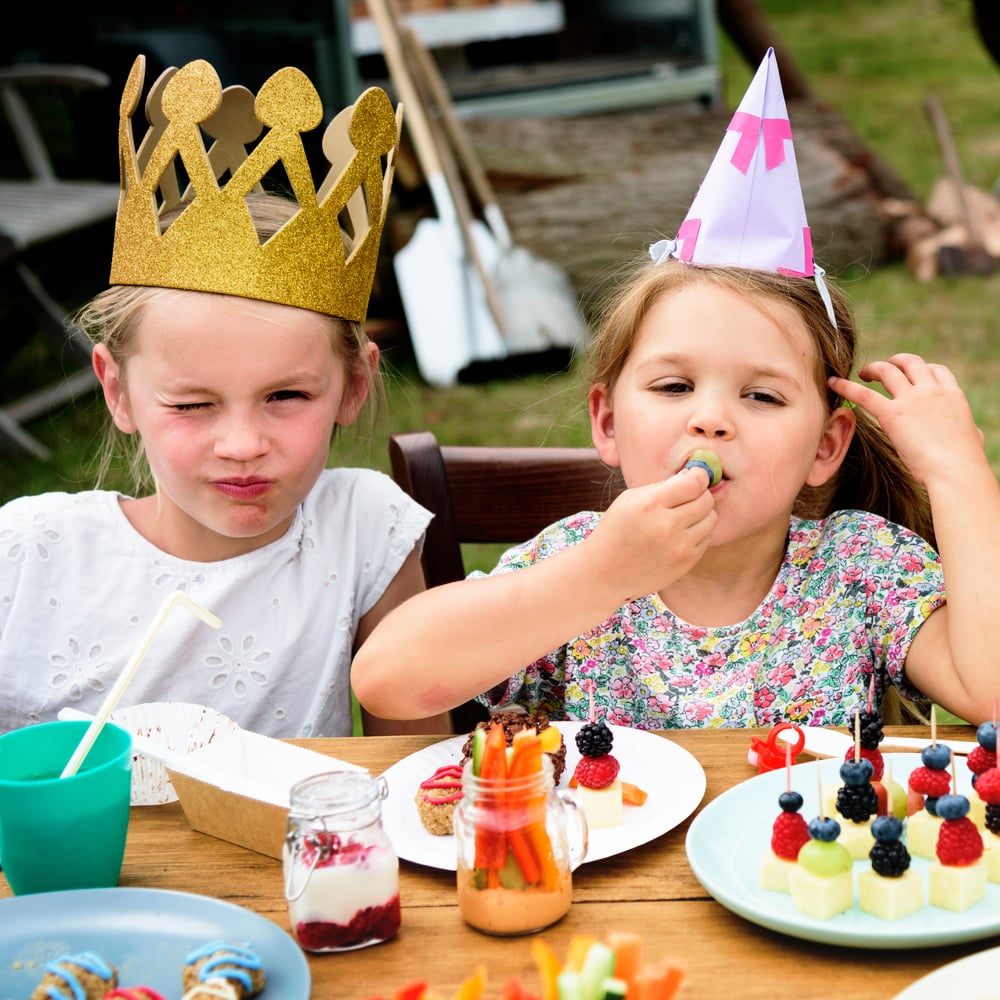 Kids enjoying indoor birthday party activities at home.