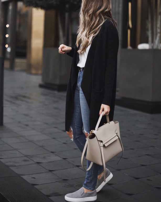 belt bag and black cardigan