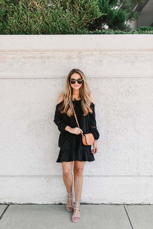 Ashley Robertson wearing a Black Dress and Tory Burch Crossbody 