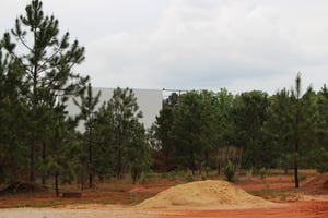 the screen tower,missing a panel now,a lot of trees cut down around screen now, and 2 ladders on the ground,also one ladder hanging from screen tower