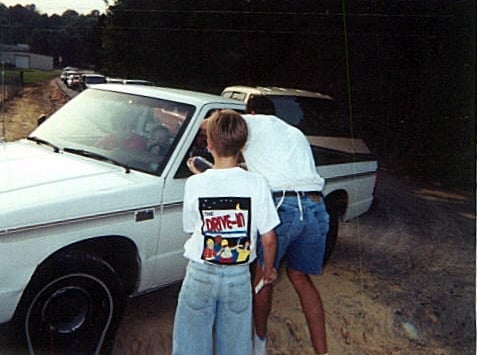 owner Brian Skinner bent over to sell another ticket; taken opening night on May 22, 1998