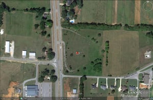 Google Earth image of former site located South of town on the East side of US-31