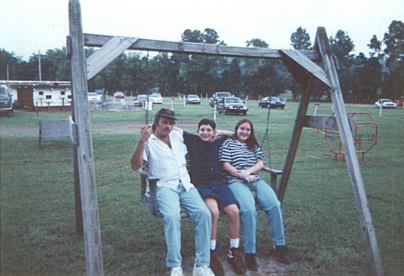 Family on a swing at the King Drive-In playground.