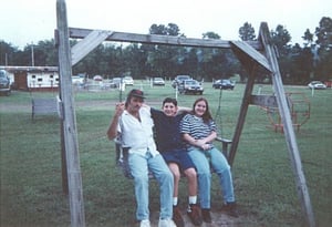 Family on a swing at the King Drive-In playground.