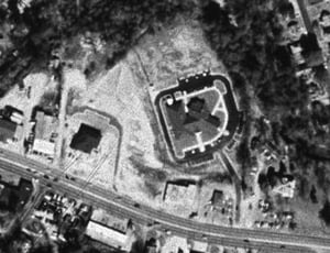 Aerial showing triagular lot; screen tower was at top area of photo; Crawford Road is at bottom. Currently used for Phenix City municipal buildings.