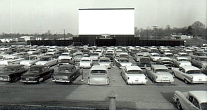 screen and field with cars lined up for an Easter SunriseService circa 1958