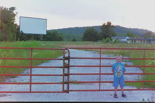 My son Mike in front of the long-gone Grove Drive-In