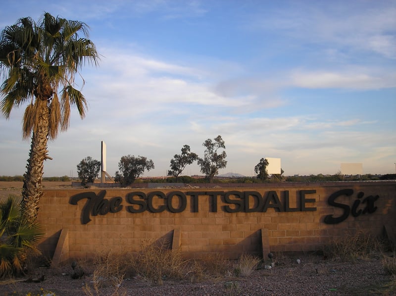 Scottsdale 6 entrance sign just outside the drive-in.  Three screens in the background.