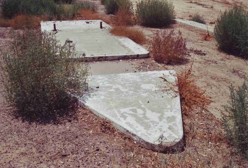 Concrete slab left of one of the two ticket booths