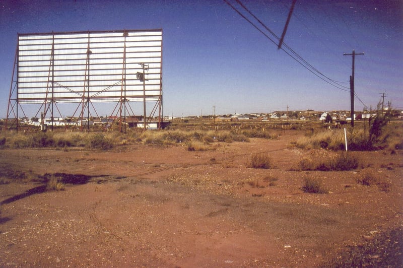 Additional exit road visible to the right of the screen tower