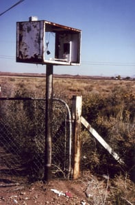 The empty and rusted exit light casing