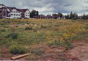 Rear side of retirement complex with field