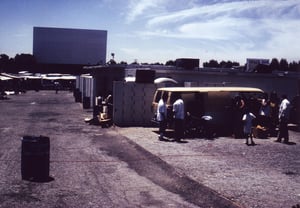 Activity  behind the projection/concession building during swap meet