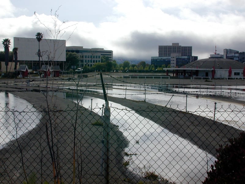 Screen 1 and Concessions building from the perimeter; flooding between the ramps