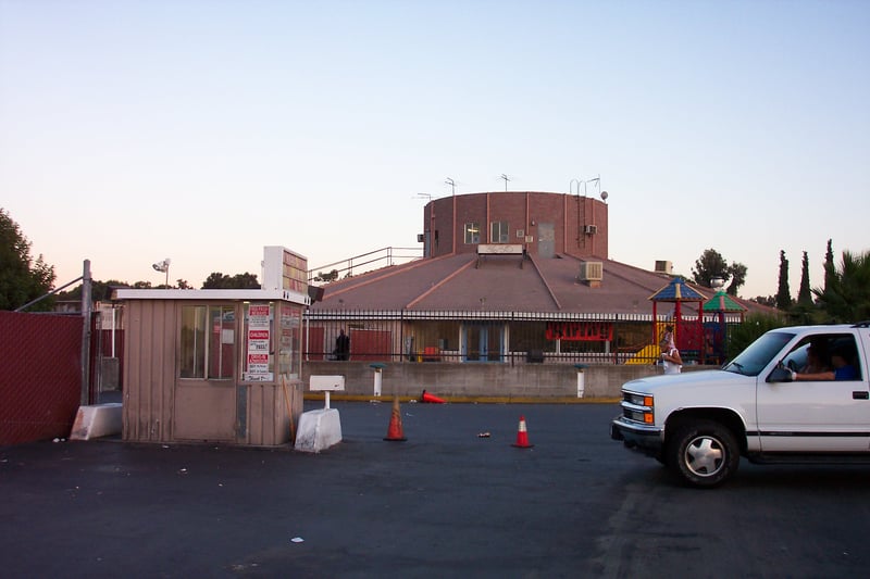 Ticket booth with snack bar/projection building in background.