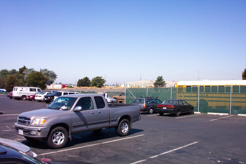 Parking lot where a screen or two used to stand.