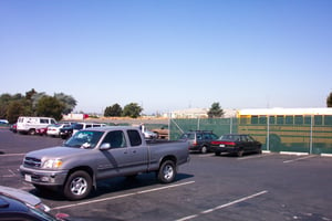 Parking lot where a screen or two used to stand.