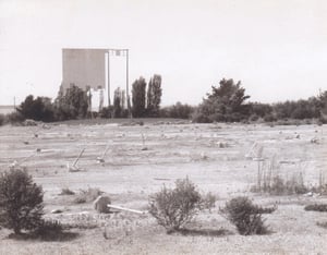 Drive-In grounds with screen showing it's age and neglect having been abandoned.  I took this as part of a photo class at Chabot College in the late 80's.