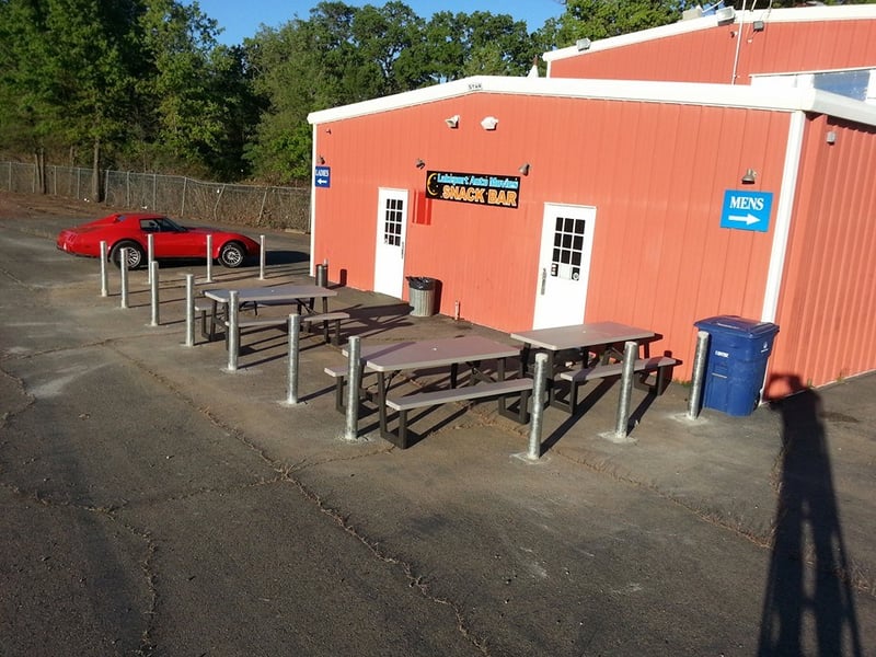 Weve added tables and a speaker in front of the snack bar so guests can enjoy their eats, and still watch the movie.