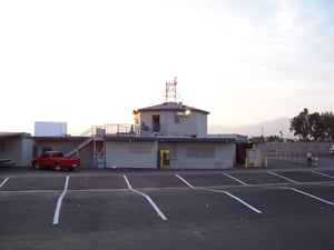 The snack bar/projection building. The open door on the ground floor is the entrance to the kitchen. The open door next to the "Snack Bar" sign is the entrance to the projection room.