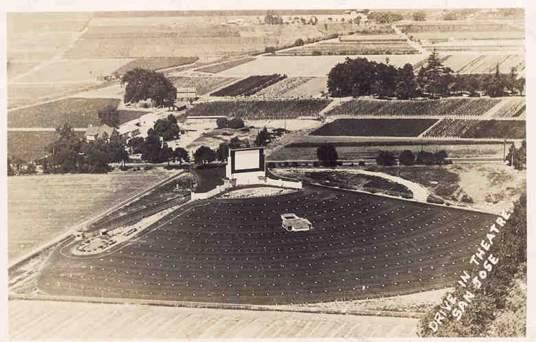 This postcard photograph is of the San Jose Drive In which later was renamed the San Jose Auto Movie. The card was sent to friends by the people operating the drive in. In the message they mention living in one of the structures to the side of the scree