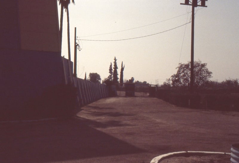 Under exposed shot of drive way and box office.