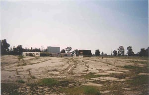 View of snack bar/office, projection house and screen #2, and the weedy lot.