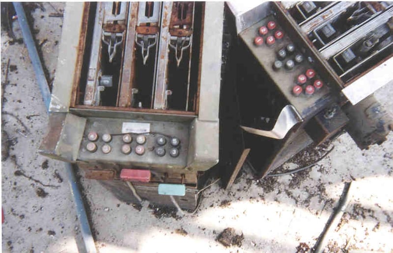 Old ticket machines, now quietly rusting away at base of screen tower.