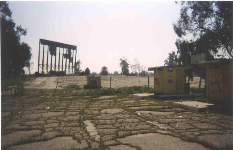 View of entranceway, you can see the ticket booths and screen tower skeleton.