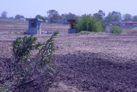 Valley 99 Drive-In, remains of ticket booths at end of entrance driveway (looking east from end of paved segment)