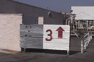 Screen 3 directional sign, with snack bar and screen 3 in background