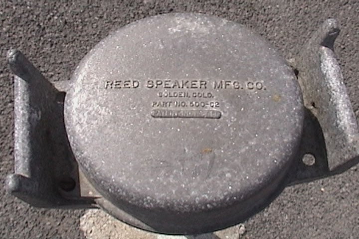 Top of speaker stand, showing the manufacturer's name