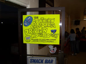 This is a sign letting people know the Southern California Drive-In Movie Society is here to make sure drive-ins will always be here. For info, email socaldims@comcast.net