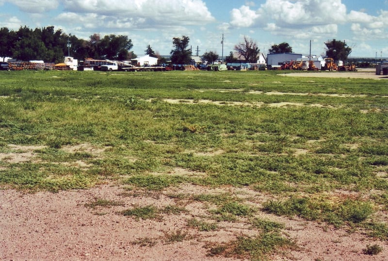 General view of the empty field outside the body shop