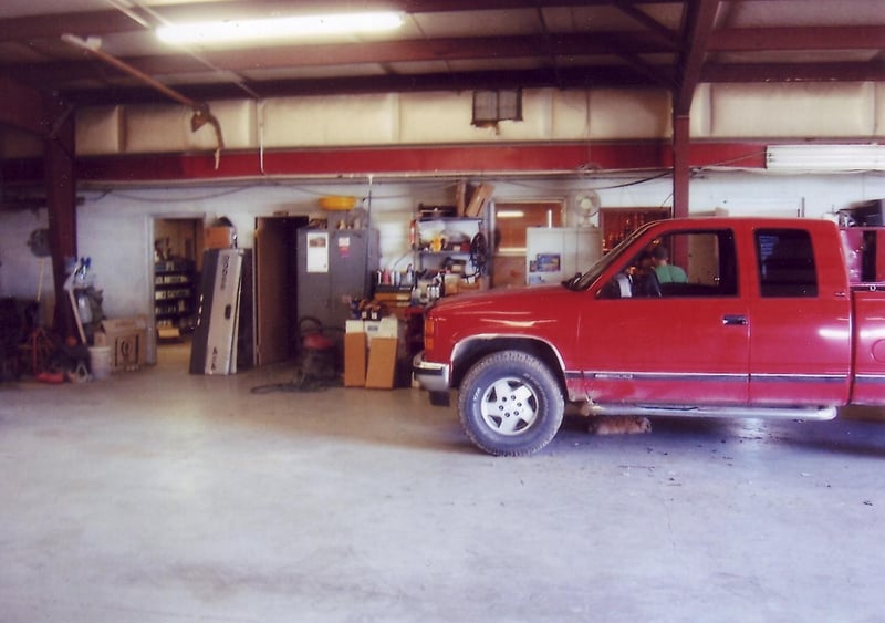 A warehouse has been built next to the concession building. The white wall is the side of the original concession building and the left door leads to the former projection booth where paints are stored today