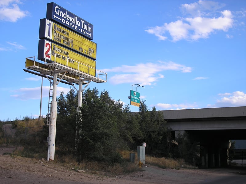 Cinderella Twin Drive-In sign next to the freeway.  This freeway overpass went over a small road that was behind the drive-in.