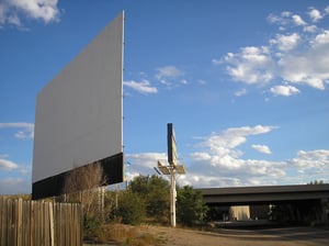 Cinderella Twin Drive-In screen, sign, and freeway overpass.