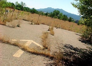 Arrow painted on concrete pointing down concrete terminal towards Rocky Mtns'