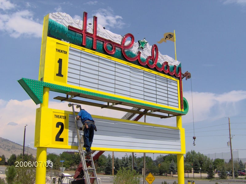 Restoration of marquee completed July 3rd, 2006.  Holiday Drive-In gone... but sign given Historical status.