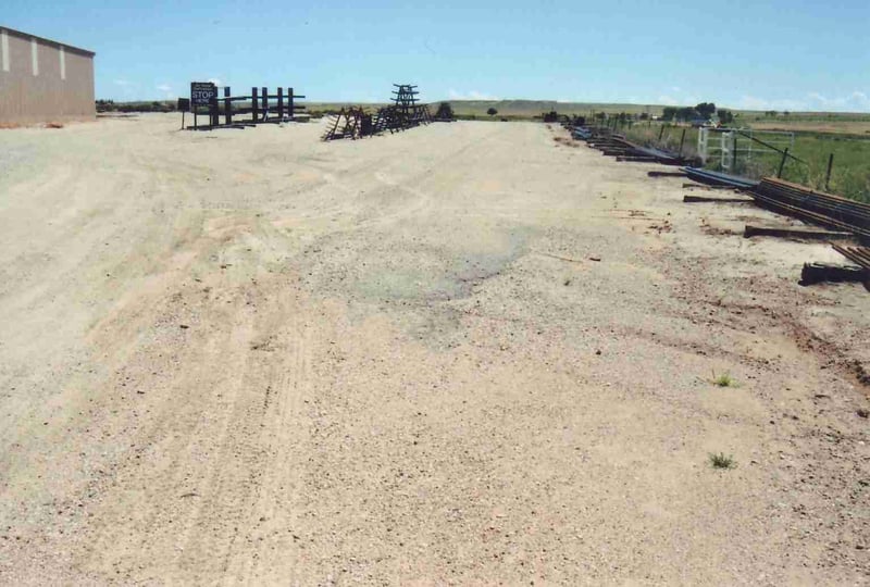 Entrance road. The asphalt patch marks the spot the ticket booth used to be located