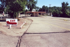 Driveway behind ticket booth with exit at left