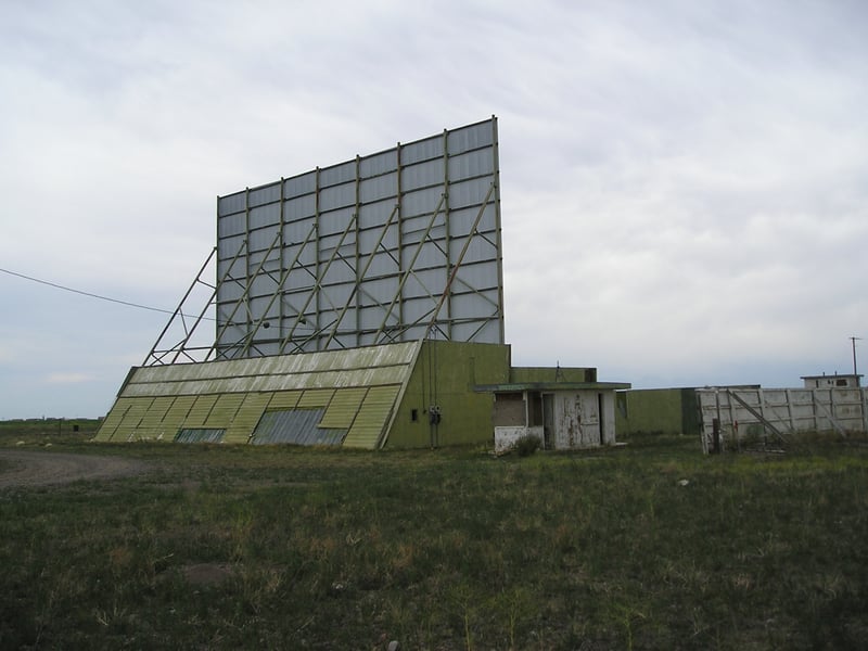 Frontier Drive-In screen and ticket booth.