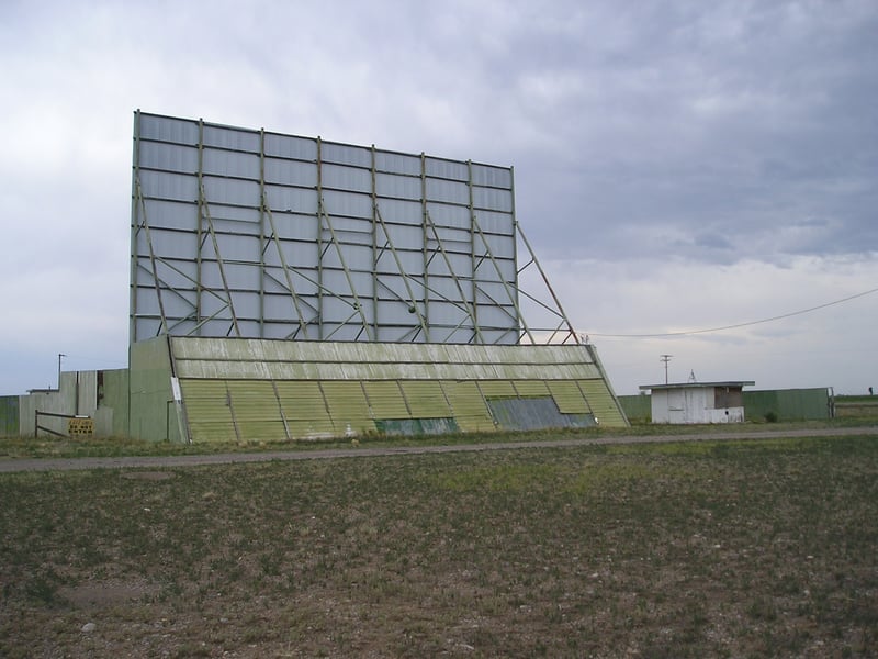 Frontier Drive-In screen and ticket booth.