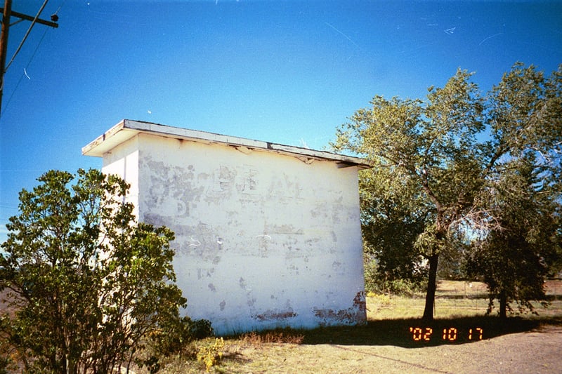 This building is at the entrance of the Peak DI, perhaps it's a projection booth? Very faint script advertising The Peak is legible on this building (squint hard).