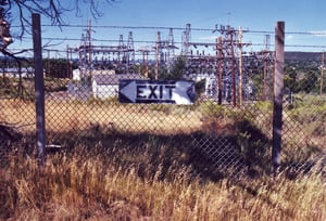 Exit sign still attached to the fence