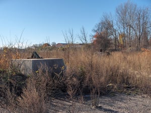 The foundation where the screen used to stand. Although the screen was brought down several months ago, nothing has been built on the site yet. It's just an open field.