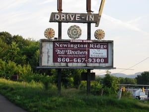 This sign over the old marquee shows the ad for the townhomes being built.