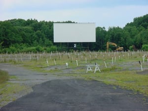 A grown-in drive-in greeted us with a backhoe in the distance. Not a great omen.
